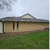Close view of new roofline and siding repair