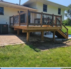 Custom wood deck with iron hand rails